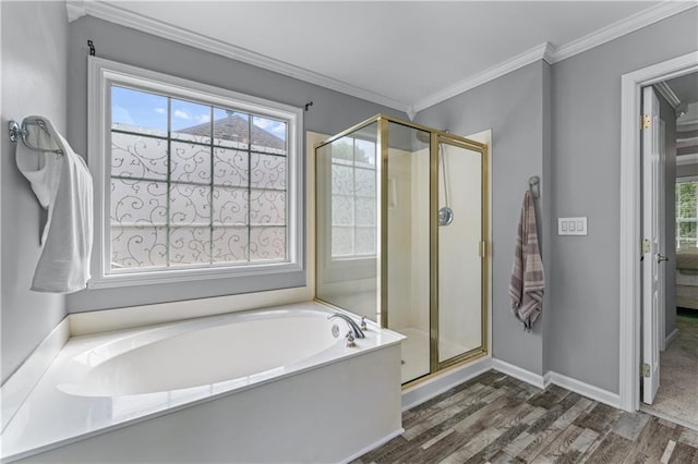859 Scales Rd, Suwanee, GA 30024 - full bathroom featuring wood finished floors, a bath, a shower stall, baseboards, and crown molding