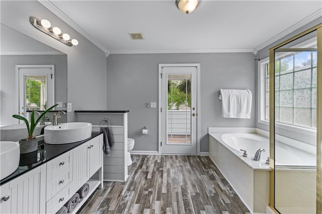 859 Scales Rd, Suwanee, GA 30024 - bathroom featuring wood finished floors, healthy amount of natural light, toilet, double vanity, and ornamental molding