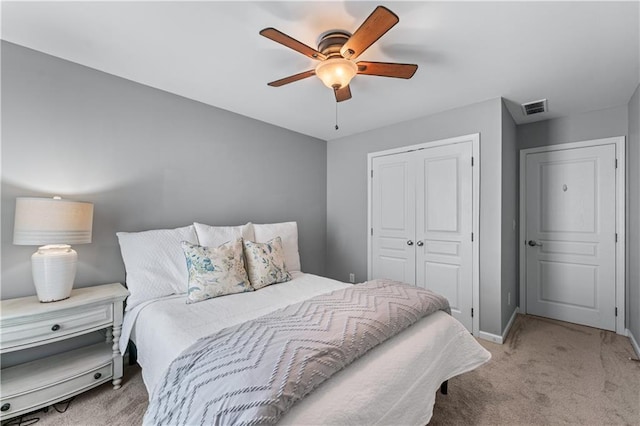 859 Scales Rd, Suwanee, GA 30024 - carpeted bedroom featuring a closet, baseboards, and a ceiling fan