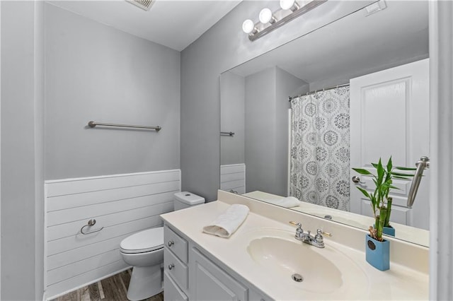 859 Scales Rd, Suwanee, GA 30024 - bathroom featuring toilet, vanity, and wood finished floors
