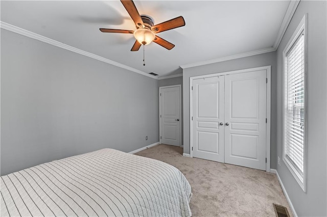 859 Scales Rd, Suwanee, GA 30024 - bedroom with light carpet, multiple windows, baseboards, ornamental molding, and a closet