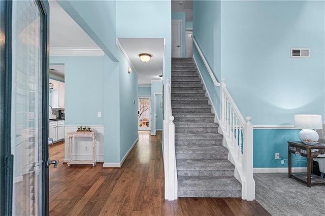 859 Scales Rd, Suwanee, GA 30024 - stairway with ornamental molding, baseboards, and wood finished floors