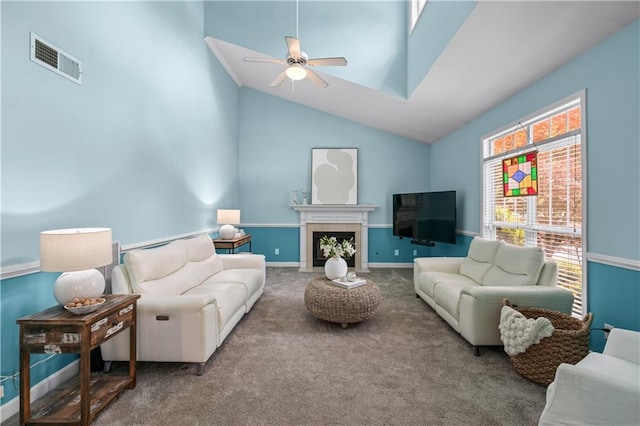 859 Scales Rd, Suwanee, GA 30024 - carpeted living area with a ceiling fan, vaulted ceiling, a fireplace with flush hearth, and baseboards