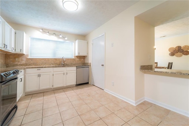 kitchen featuring stainless steel dishwasher, black range with electric stovetop, a sink, decorative backsplash, and light stone counters
