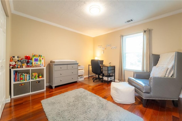 office space with wood-type flooring, crown molding, and baseboards
