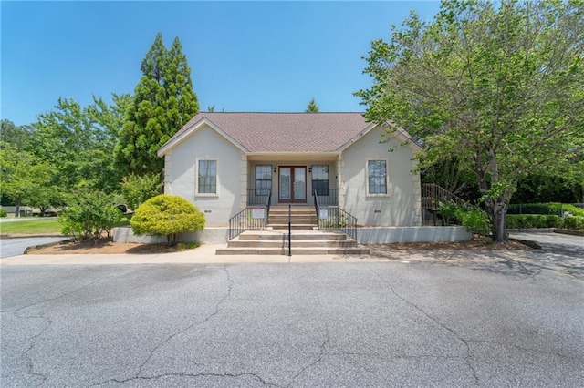 view of front of home featuring a shingled roof