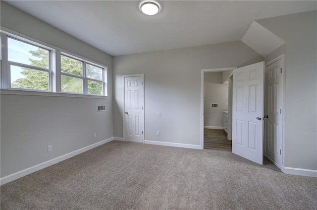 unfurnished bedroom featuring carpet floors and baseboards