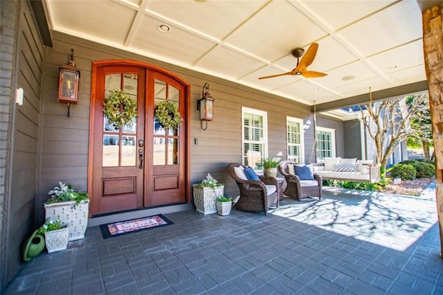 202 Hickory Chase, Carrollton, GA 30117 - property entrance featuring french doors, ceiling fan, and outdoor lounge area