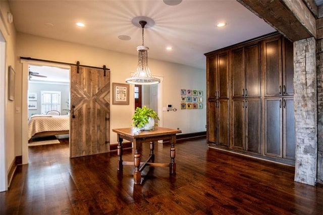 202 Hickory Chase, Carrollton, GA 30117 - dining room with dark wood-style flooring, a barn door, recessed lighting, and baseboards