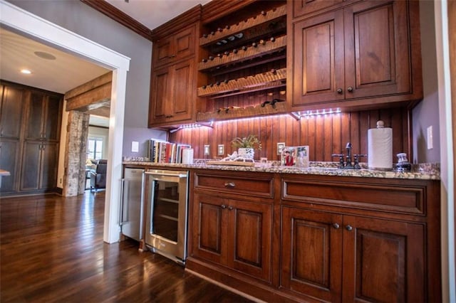 202 Hickory Chase, Carrollton, GA 30117 - indoor wet bar featuring beverage cooler, dark wood-style flooring, and ornamental molding