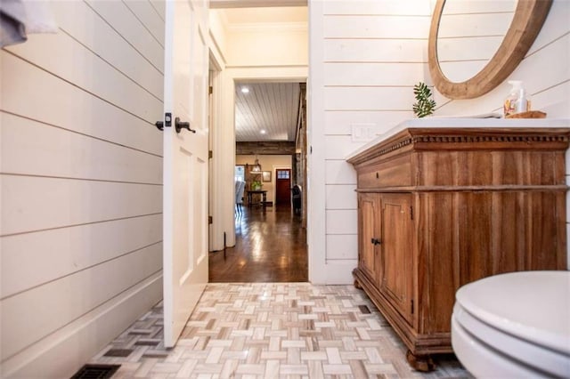 202 Hickory Chase, Carrollton, GA 30117 - corridor with parquet floors and wood walls