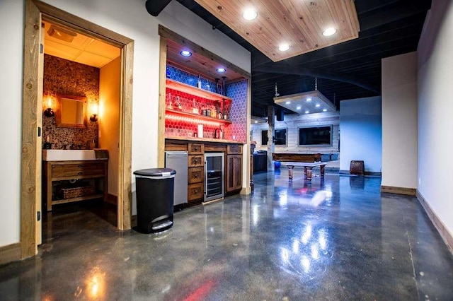 202 Hickory Chase, Carrollton, GA 30117 - indoor dry bar with finished concrete flooring, wine cooler, fridge, and recessed lighting