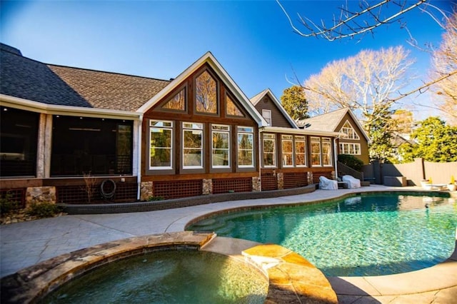 202 Hickory Chase, Carrollton, GA 30117 - view of swimming pool featuring a sunroom, fence, and a pool with connected hot tub