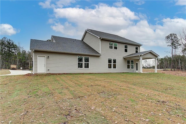 rear view of house with a yard