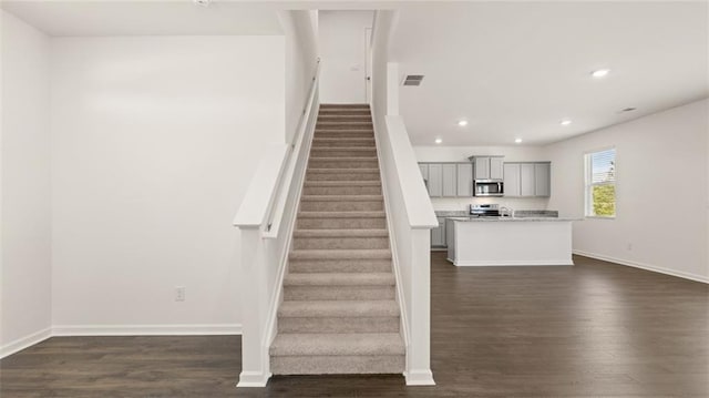 613 Lobelia Way, Locust Grove, GA 30248 - stairs featuring wood finished floors, recessed lighting, and baseboards
