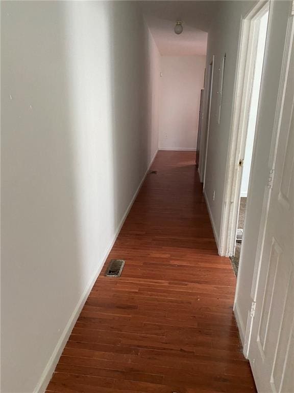 hallway featuring dark hardwood / wood-style floors