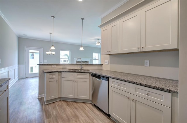 kitchen featuring pendant lighting, sink, stainless steel dishwasher, kitchen peninsula, and light wood-type flooring