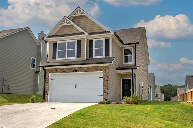 craftsman inspired home featuring a garage and a front lawn