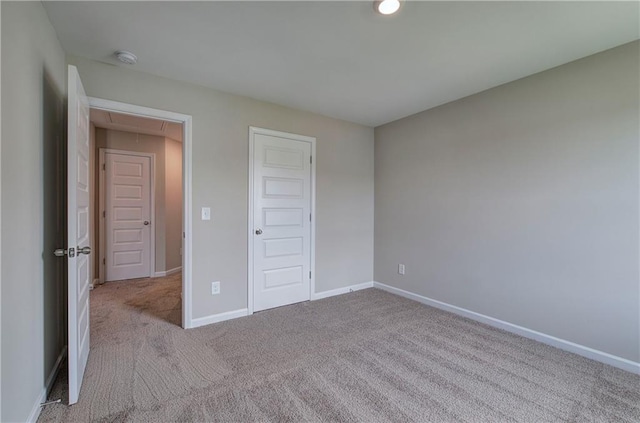 unfurnished bedroom featuring light colored carpet