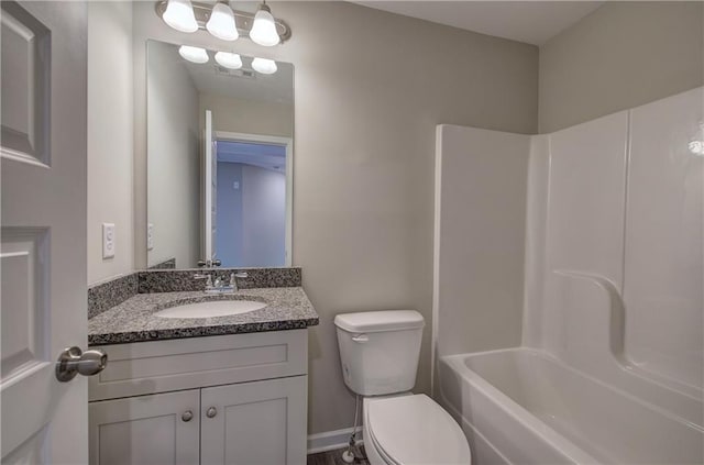 full bathroom with vanity, toilet, and washtub / shower combination