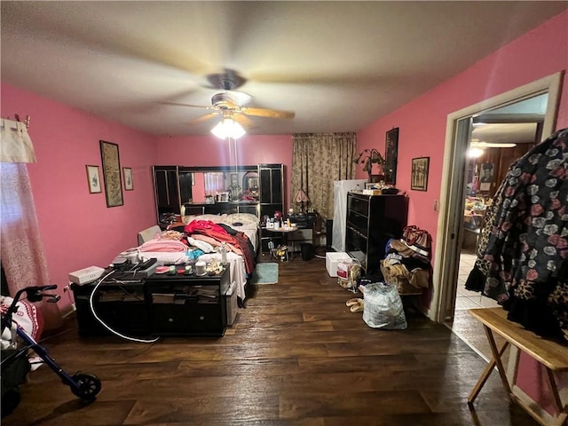 bedroom featuring ceiling fan and wood finished floors