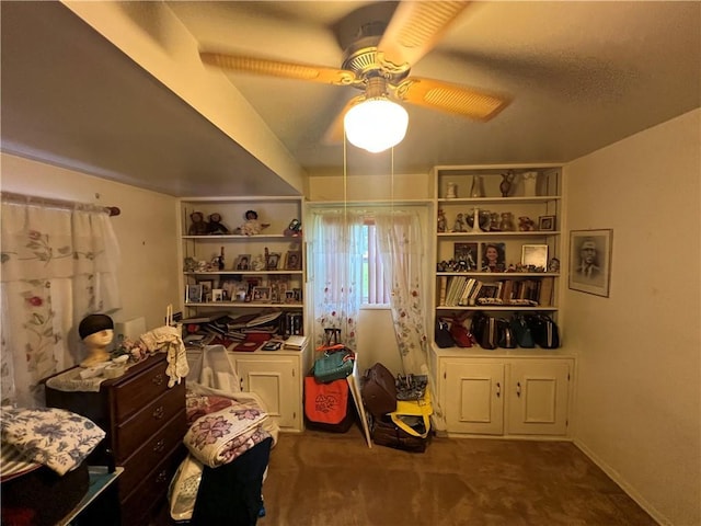 misc room with carpet floors and ceiling fan