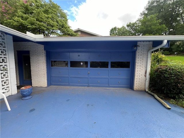 garage featuring driveway