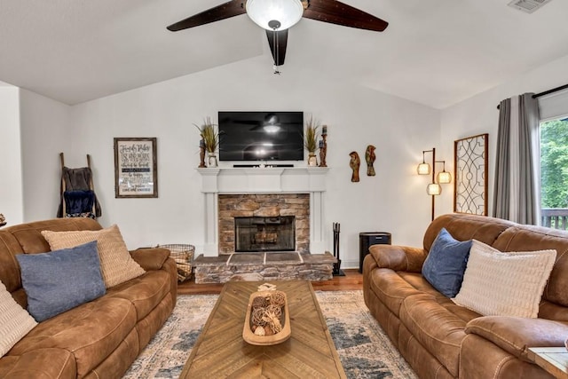 1464 Fieldstone Ct, Winder, GA 30680 - living room with a ceiling fan, wood finished floors, and a fireplace