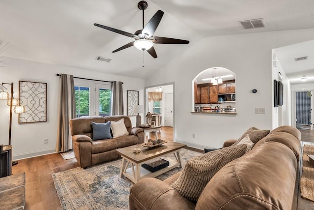 1464 Fieldstone Ct, Winder, GA 30680 - living room featuring lofted ceiling, ceiling fan, and wood finished floors