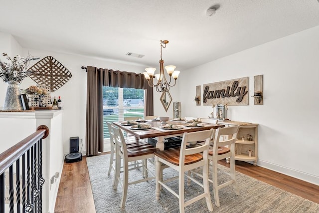 1464 Fieldstone Ct, Winder, GA 30680 - dining room featuring a chandelier and wood finished floors