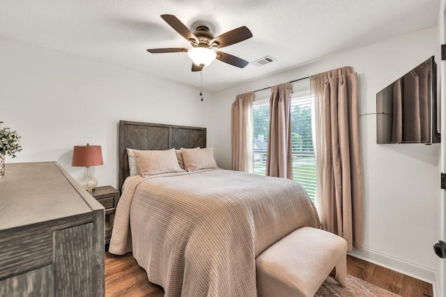 1464 Fieldstone Ct, Winder, GA 30680 - bedroom with dark wood finished floors and ceiling fan