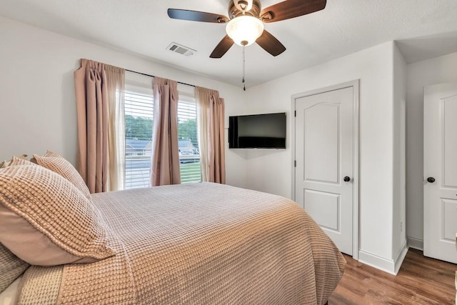 1464 Fieldstone Ct, Winder, GA 30680 - bedroom featuring wood finished floors and ceiling fan