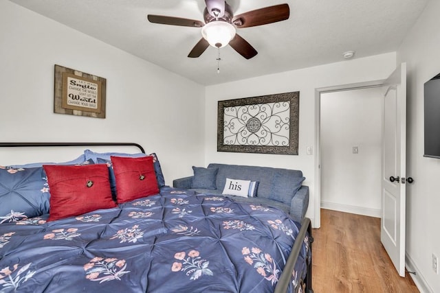 1464 Fieldstone Ct, Winder, GA 30680 - bedroom with wood finished floors and ceiling fan