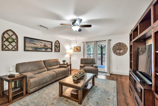 1464 Fieldstone Ct, Winder, GA 30680 - living area featuring a ceiling fan and dark wood-style flooring