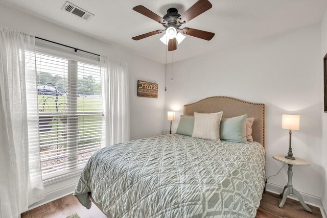 1464 Fieldstone Ct, Winder, GA 30680 - bedroom with wood finished floors and a ceiling fan