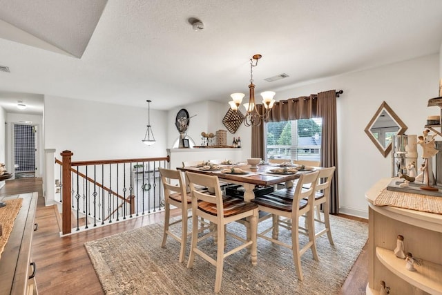 1464 Fieldstone Ct, Winder, GA 30680 - dining room featuring a chandelier and light wood-style floors