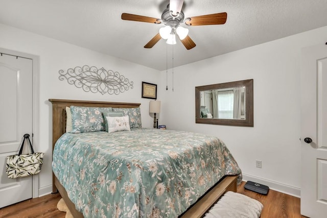 1464 Fieldstone Ct, Winder, GA 30680 - bedroom featuring wood finished floors and a ceiling fan