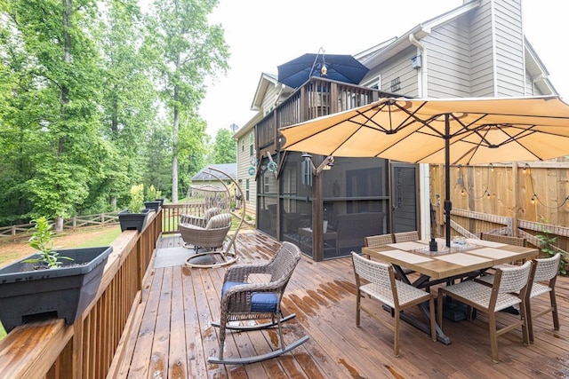 1464 Fieldstone Ct, Winder, GA 30680 - wooden deck featuring outdoor dining space and a fenced backyard