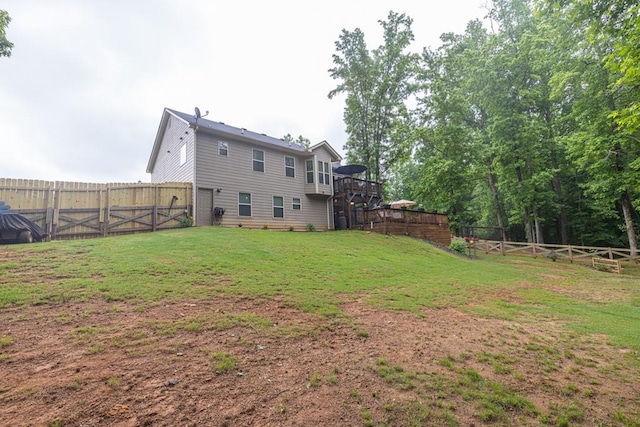 1464 Fieldstone Ct, Winder, GA 30680 - fenced backyard featuring a wooden deck, stairs, and a gate