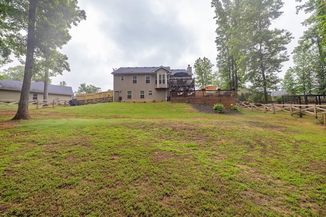 1464 Fieldstone Ct, Winder, GA 30680 - fenced backyard featuring a wooden deck