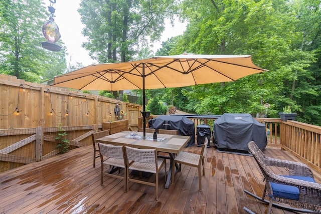 1464 Fieldstone Ct, Winder, GA 30680 - wooden deck featuring area for grilling and outdoor dining area