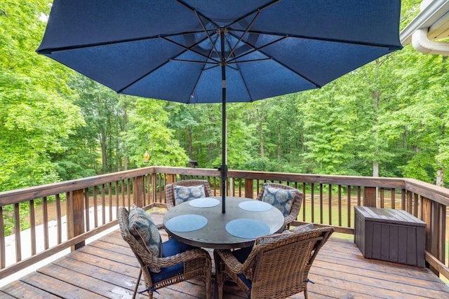 1464 Fieldstone Ct, Winder, GA 30680 - wooden terrace featuring outdoor dining area and a forest view