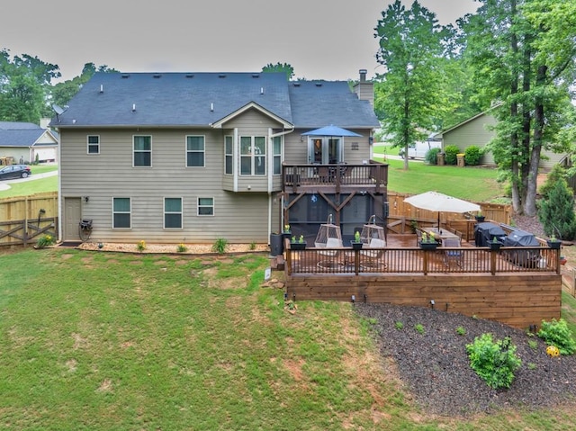 1464 Fieldstone Ct, Winder, GA 30680 - rear view of house with a deck, a fenced backyard, and a chimney