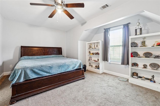 carpeted bedroom with vaulted ceiling, ceiling fan, and baseboards