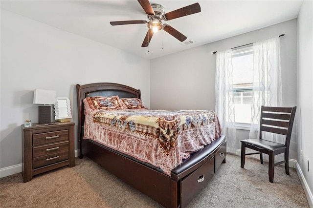 carpeted bedroom featuring baseboards and ceiling fan