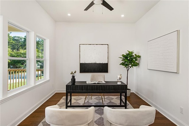 home office featuring ceiling fan and dark hardwood / wood-style floors