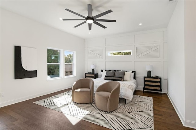 bedroom with ceiling fan and dark hardwood / wood-style floors