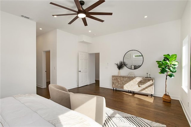 bedroom with ceiling fan and dark wood-type flooring