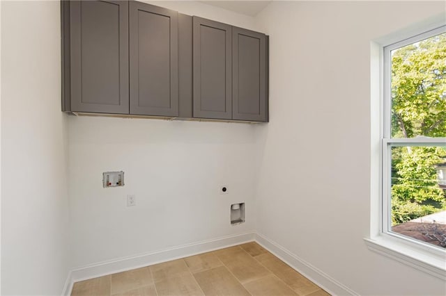 laundry area featuring electric dryer hookup, cabinets, and washer hookup