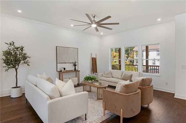 living room featuring ceiling fan, crown molding, and dark hardwood / wood-style flooring